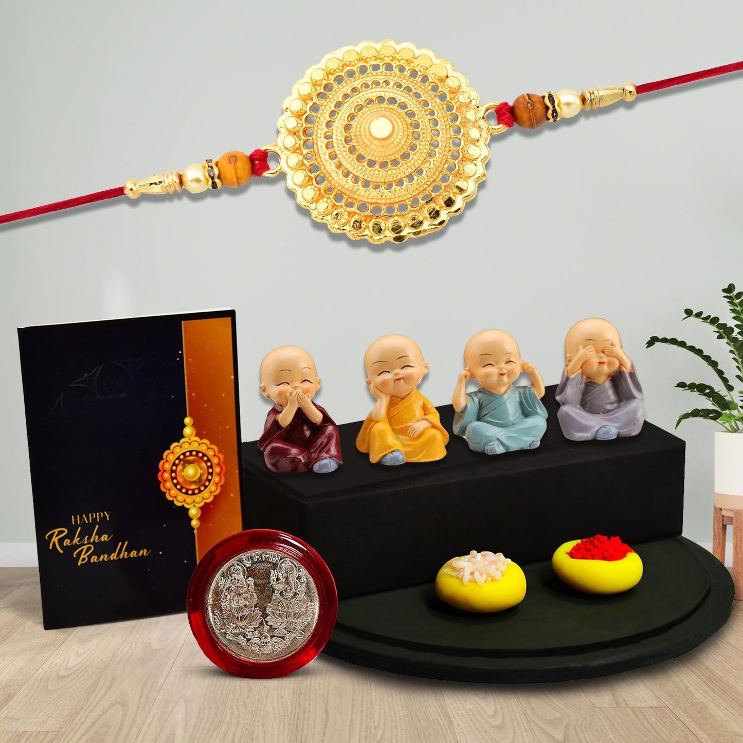 Big Golden Round Rakhi With Decorative Baby Buddha Gift ,Silver Color Pooja Coin, Roli Chawal & Greeting Card - Needs You