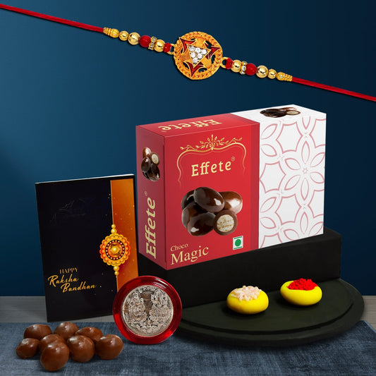 Circle Shape With Red & Golden Color Beads With Effete Magic Chocolate 32Gm ,Silver Color Pooja Coin, Roli Chawal & Greeting Card - Needs You