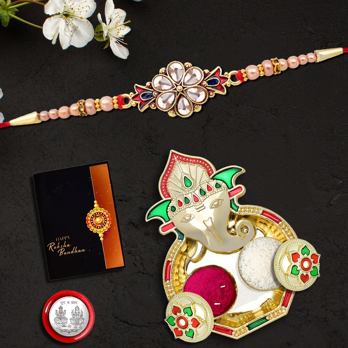 Flower Diamond Rakhi With Red And Blue Mina With Ganesha Pooja Thali Set ,Silver Color Pooja Coin, Roli Chawal & Greeting Card - Needs You