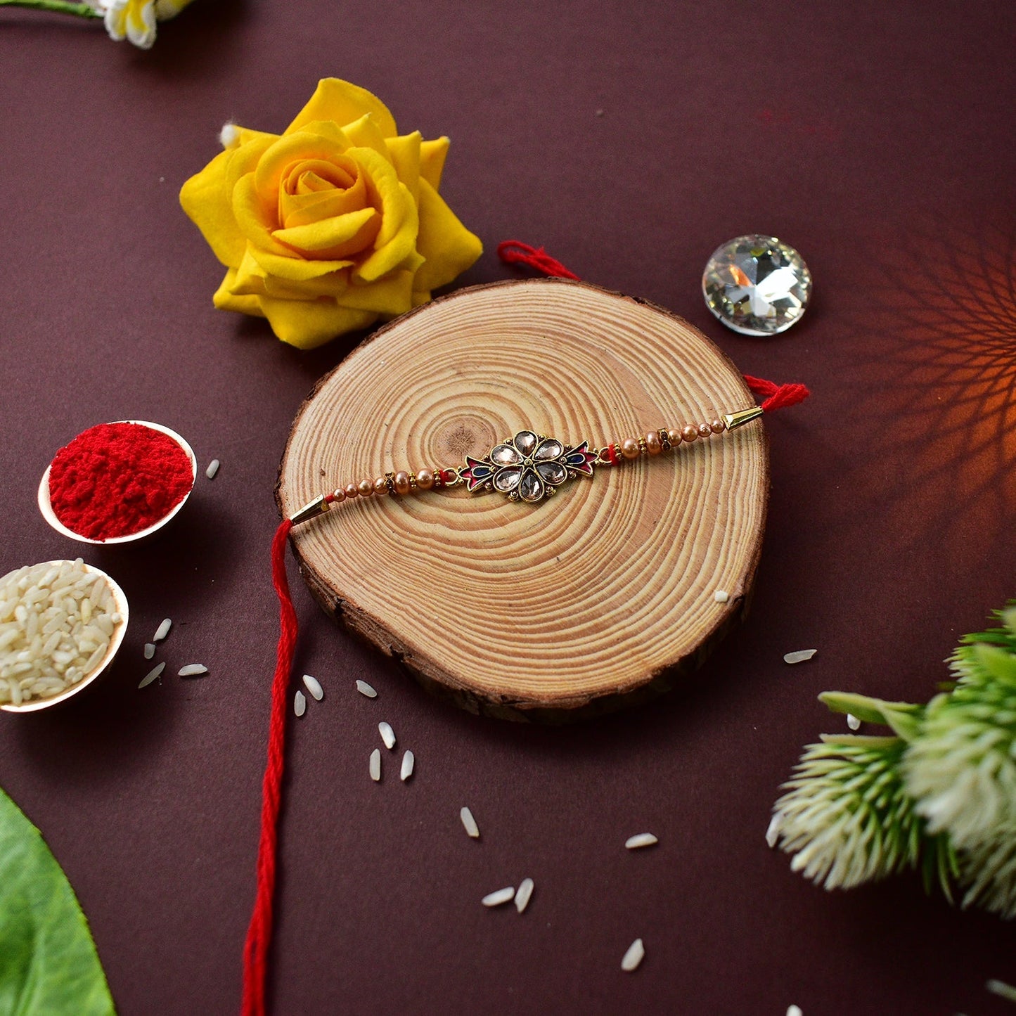 Flower Diamond Rakhi With Red And Blue Mina With Ganesha Pooja Thali Set ,Silver Color Pooja Coin, Roli Chawal & Greeting Card - Needs You