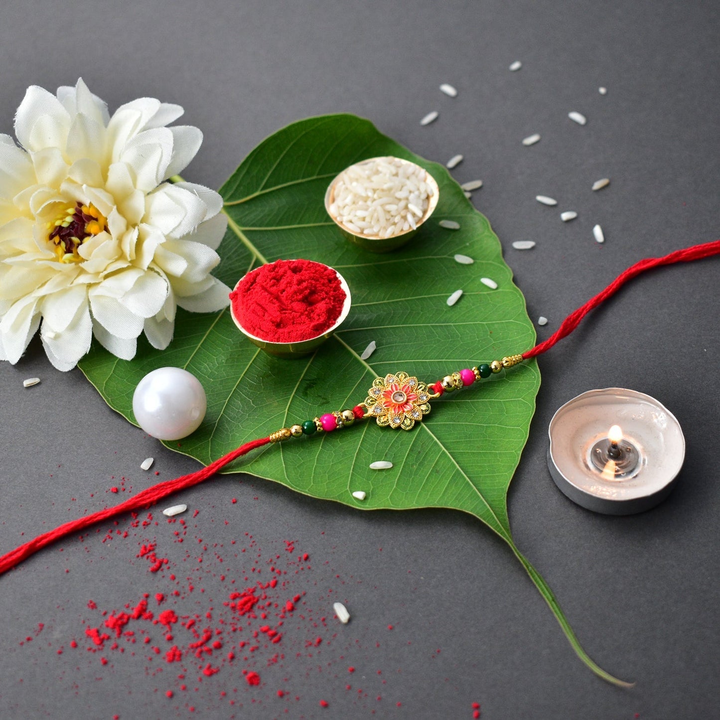 Green And Red Flower Rakhi With Ganesha Pooja Thali Set ,Silver Color Pooja Coin, Roli Chawal & Greeting Card - Needs You