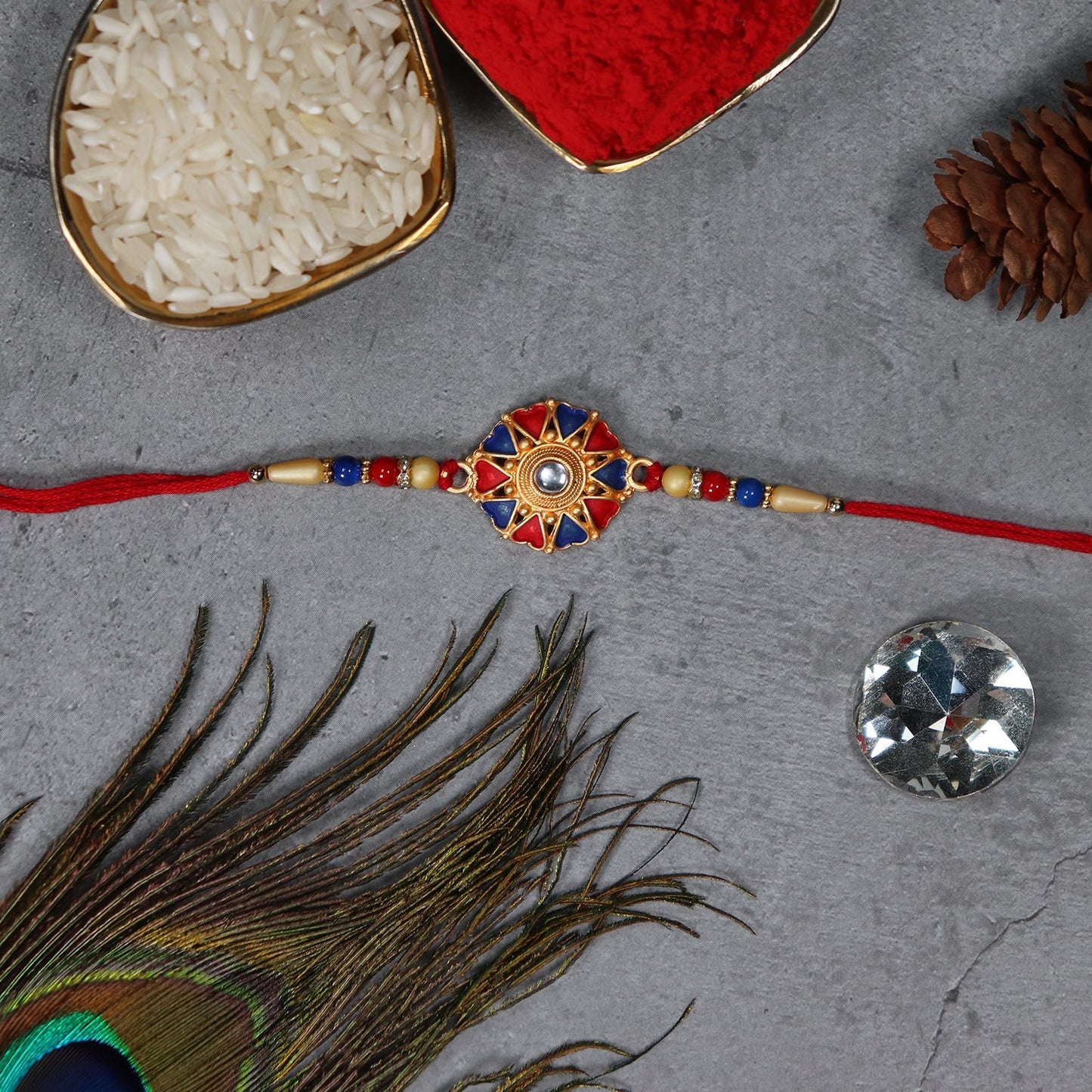 Mor With Morpichh Rakhi And Round Traditional Rakhi With Red And Blue Mina Work With Decorative Baby Buddha Gift ,Silver Color Pooja Coin, Roli Chawal & Greeting Card - Needs You