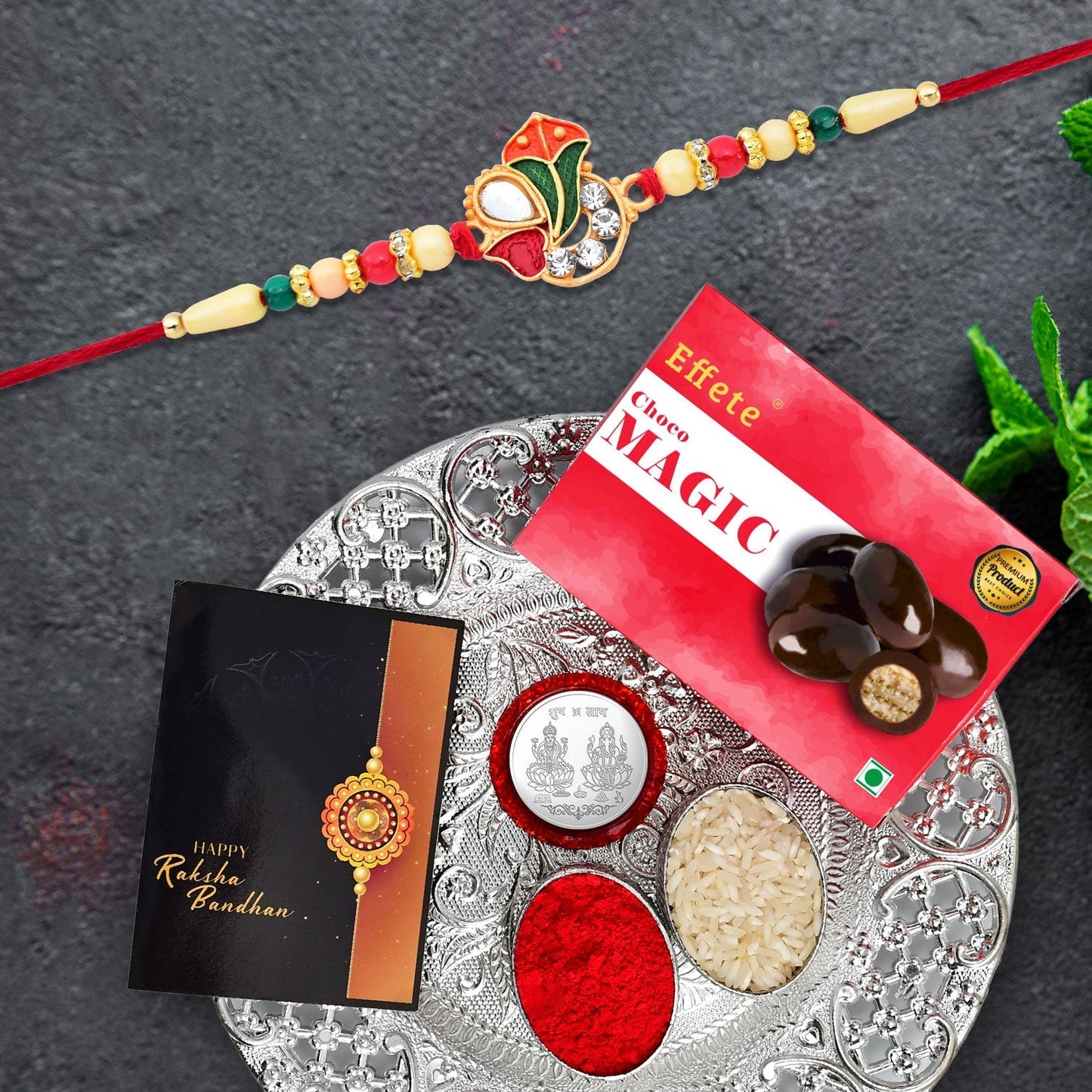 Om Design With Colorful Beads With Effete Choco Magic Chocolate 32Gm With Pooja Thali ,Silver Color Pooja Coin, Roli Chawal & Greeting Card - Needs You