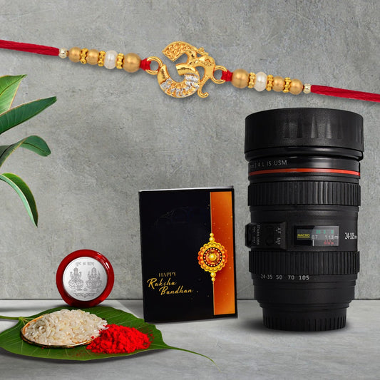 Om Golden Color Rakhi With Diamonds With Coffee Camera Lense Mug ,Silver Color Pooja Coin, Roli Chawal & Greeting Card - Needs You