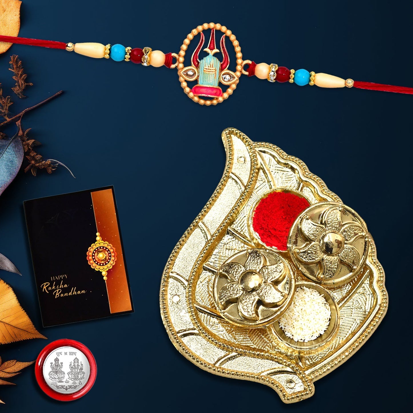 Shivling With Trishul Rakhi With Leaf Pooja Thali Set ,Silver Color Pooja Coin, Roli Chawal & Greeting Card - Needs You