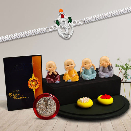 Silver Color Ganesh Rakhi With Decorative Baby Buddha Gift ,Silver Color Pooja Coin, Roli Chawal & Greeting Card - Needs You