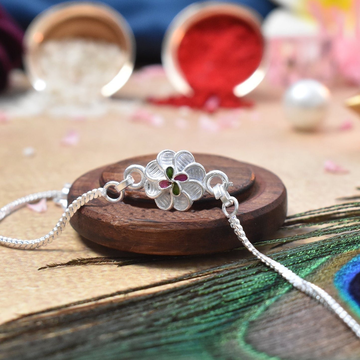 Sparkly Silver Bracelet With A Pretty Flower With Effete Assorted Chocolate 96Gm ,Silver Color Pooja Coin, Roli Chawal & Greeting Card - Needs You